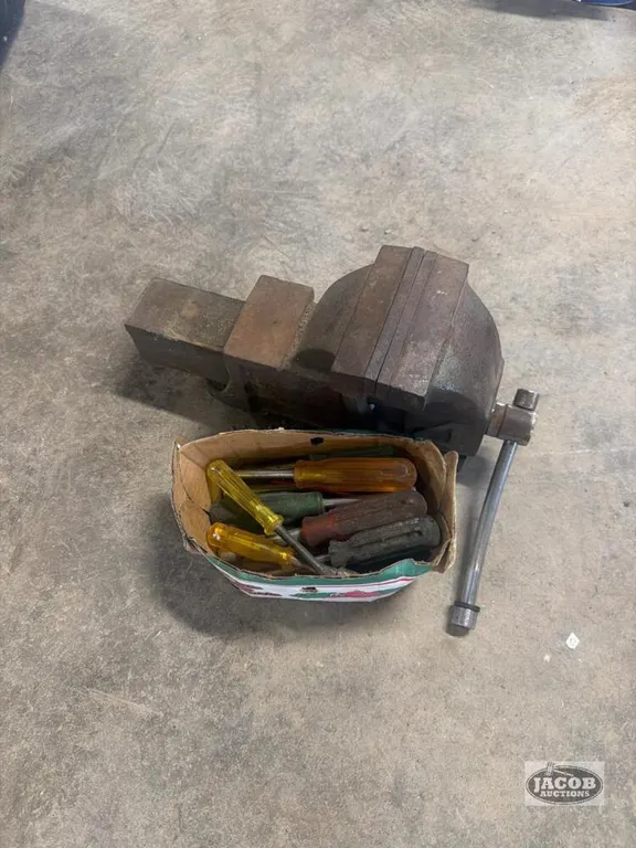 Bench vise and screw drivers