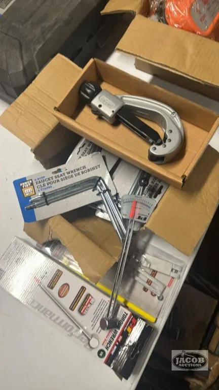 Tube cutter , faucet seat, wrench , misc