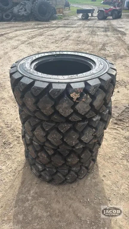 Unused 10-16.5 skid steer tire x4