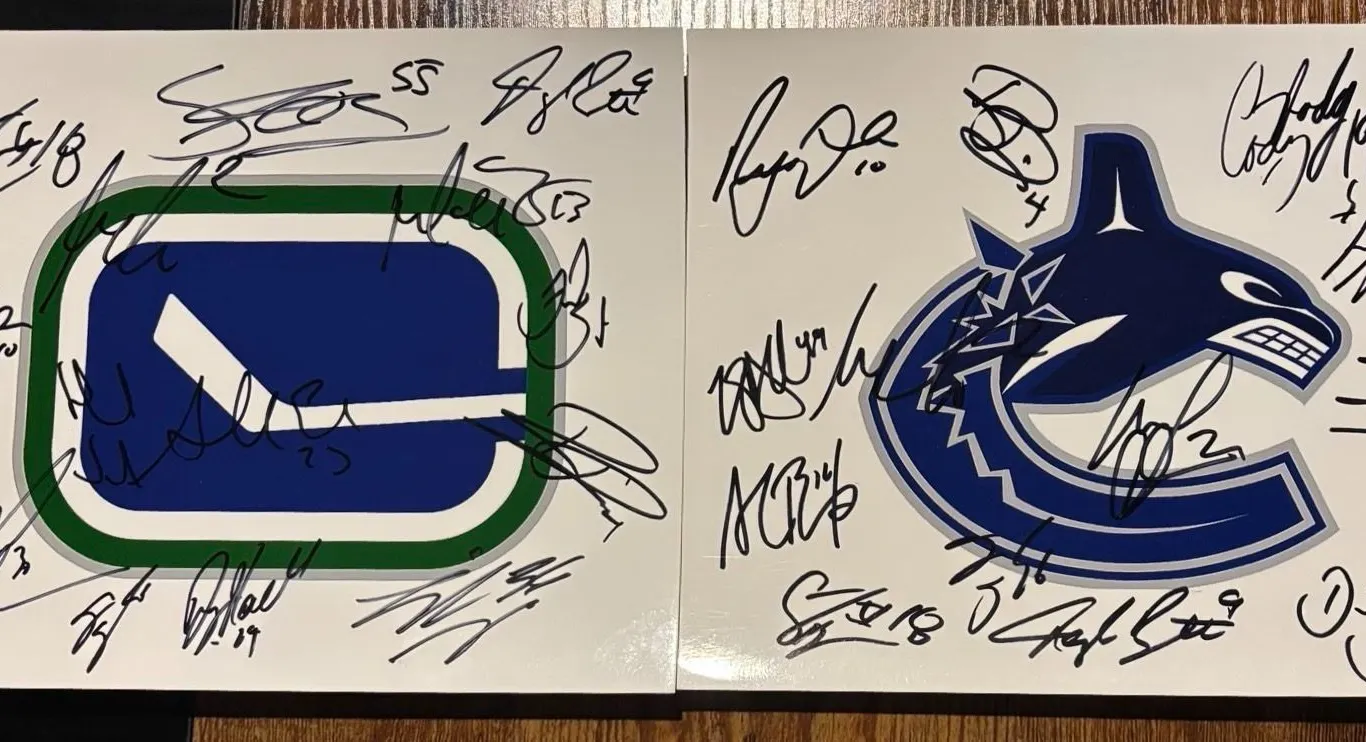 Vancouver Canucks Multi-Signed Logo Photos Pair