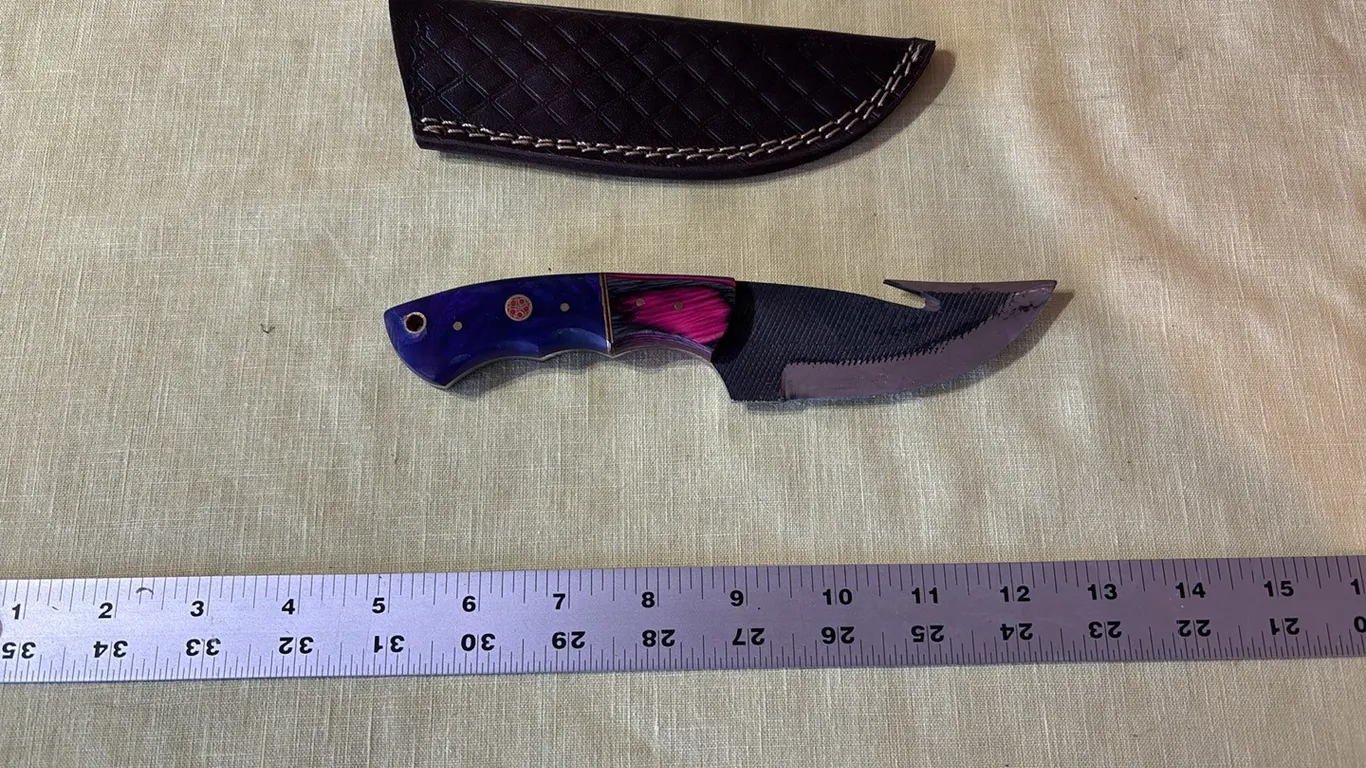 Damascus steel knife with gut hook