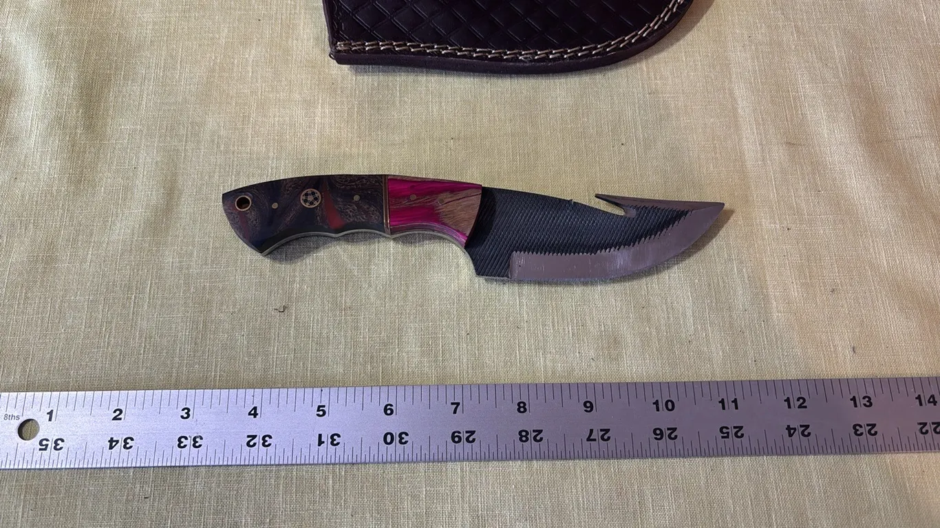 Damascus steel knife with gut hook