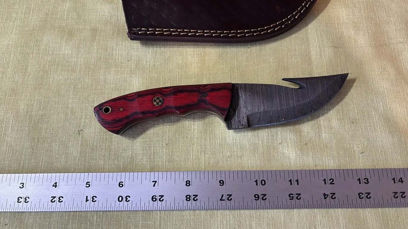 Damascus steel knife with gut hook