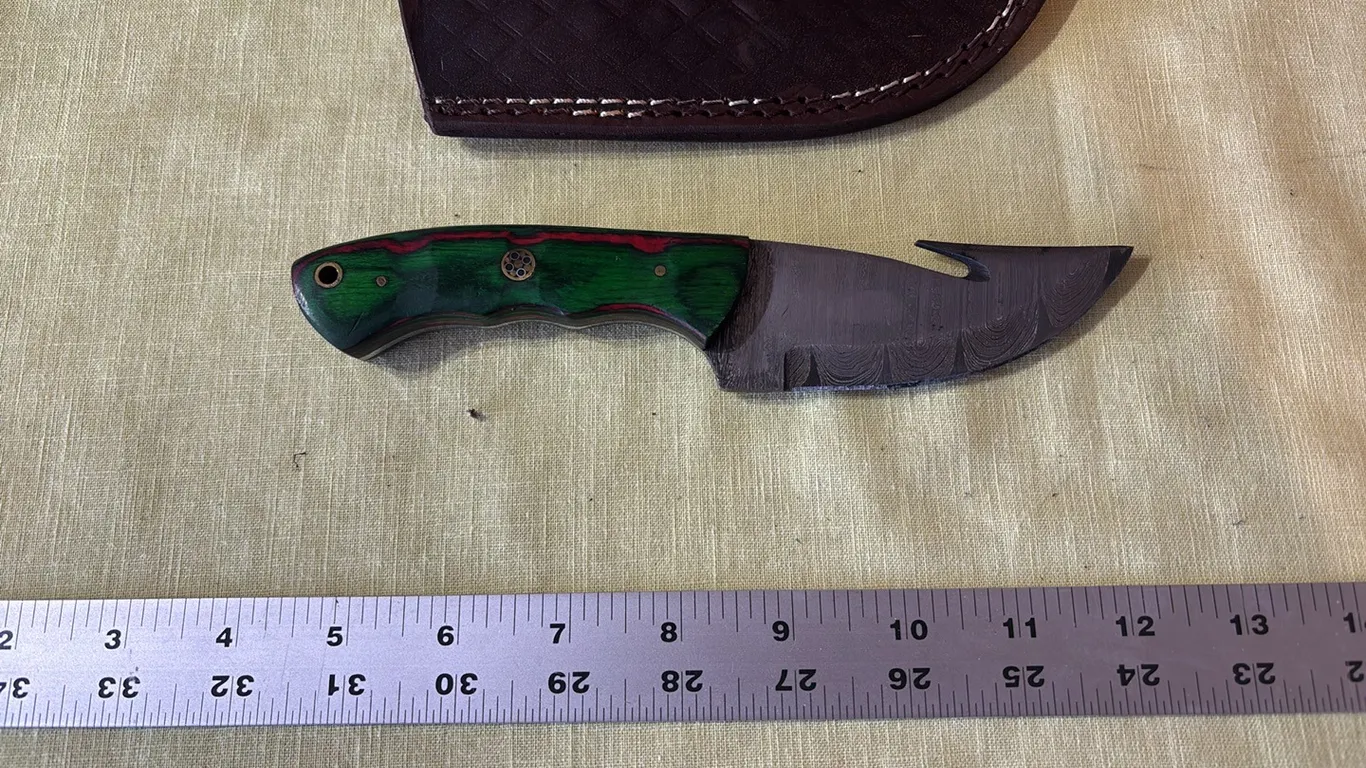 Damascus steel knife with gut hook
