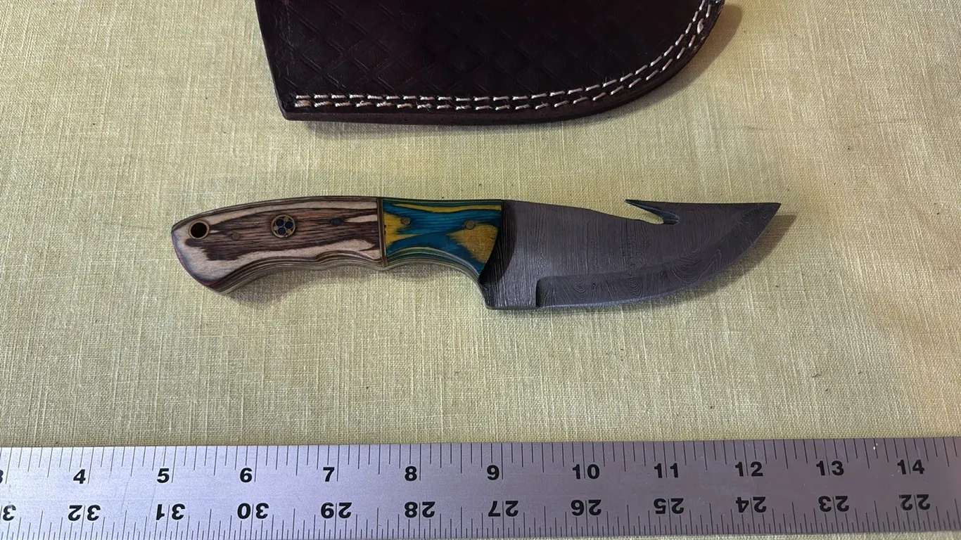 Damascus steel knife with gut hook