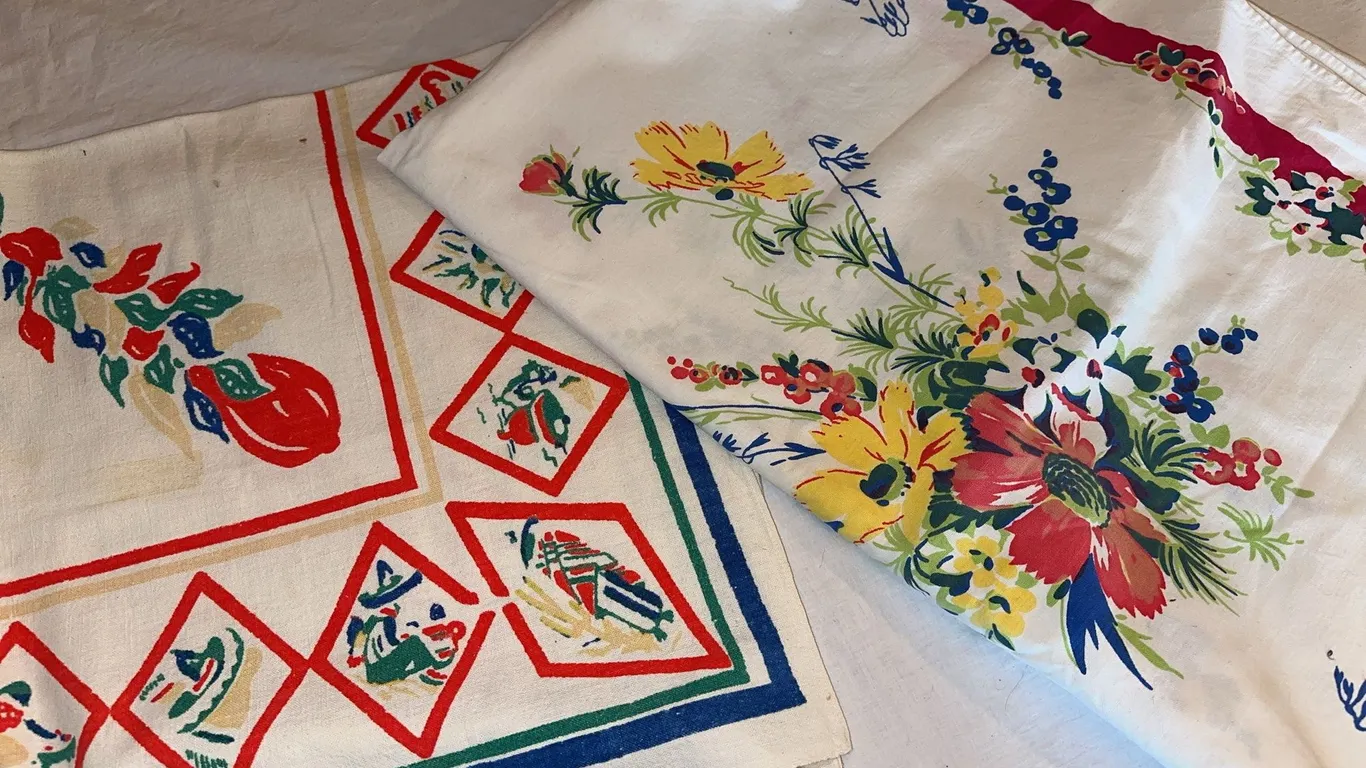Two vintage printed tablecloths