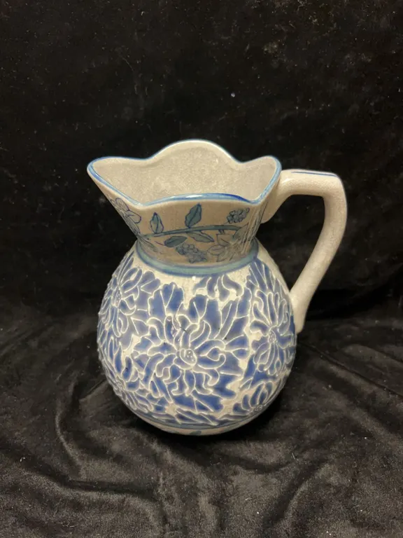 Blue and White Stoneware Jug with Floral Relief Motif
