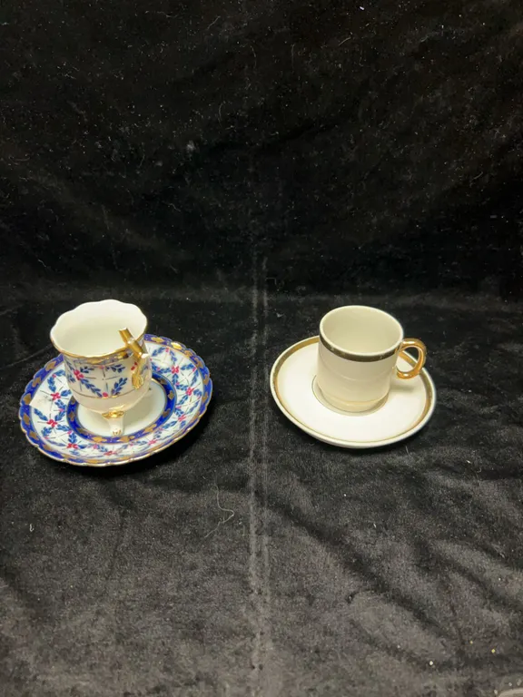 Two Porcelain Demitasse Cup and Saucer Sets, Gold Accents