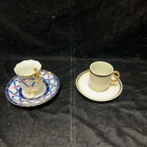 Two Porcelain Demitasse Cup and Saucer Sets, Gold Accents