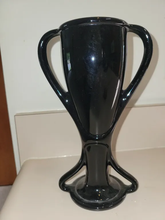 Vintage Fostoria Art Deco "Tut" black amethyst glass trophy vase featuring two graceful curved handl