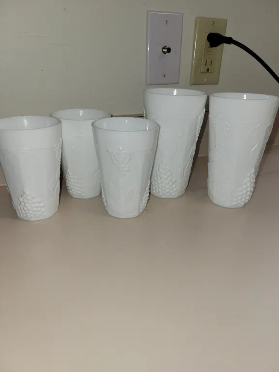 5 total= 3 vintage white milk glass tumblers featuring an embossed grapevine and cluster pattern. 12