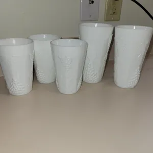5 total= 3 vintage white milk glass tumblers featuring an embossed grapevine and cluster pattern. 12