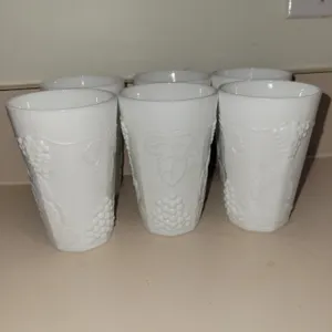 white milk glass tumblers in the "Harvest Grape" (or "Grapes & Leaves") pattern made by Indiana Glas