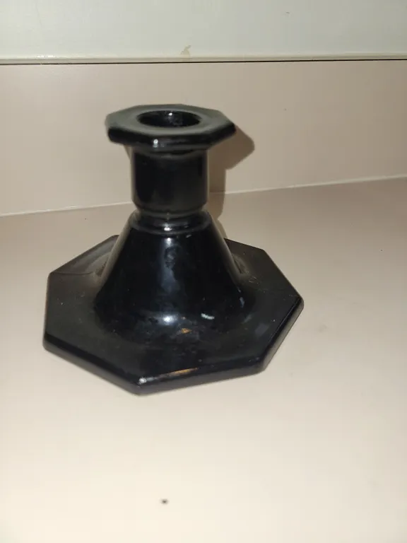 vintage black glass candlestick holder featuring a distinctive hexagonal base