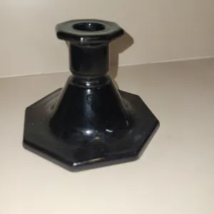vintage black glass candlestick holder featuring a distinctive hexagonal base