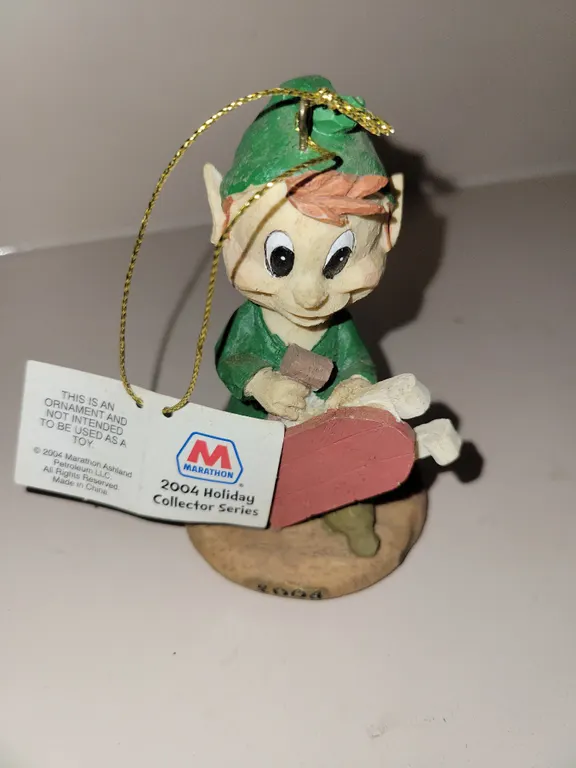 2004 Marathon Oil Elf with Sled Christmas Ornament from the holiday collector series.