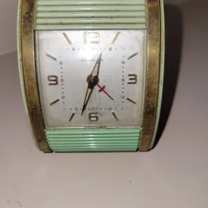 vintage Westclox Travalarm wind-up travel alarm clock from the early 1960s, featuring a seafoam gree