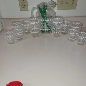 vintage mid-century modern glassware set featuring a matching pitcher and tumblers with a white loop