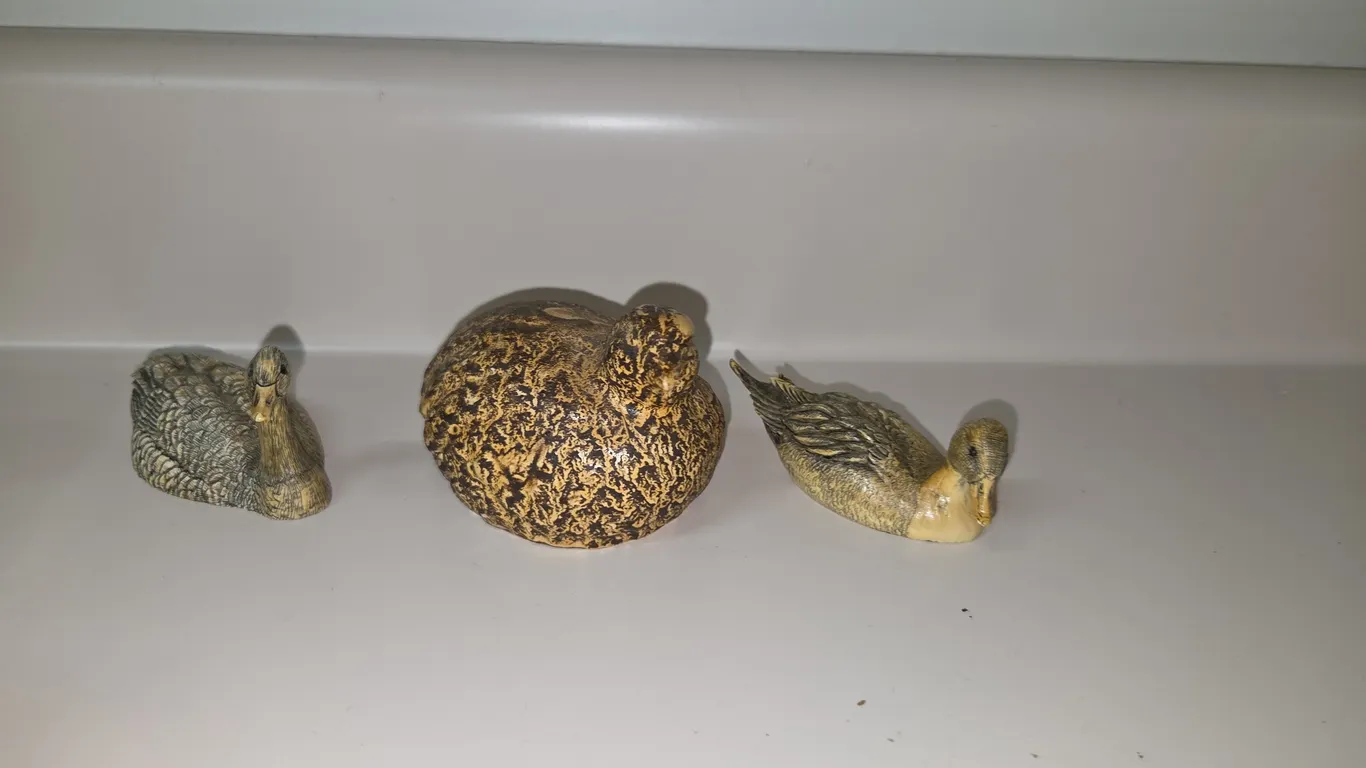 3 duck statues