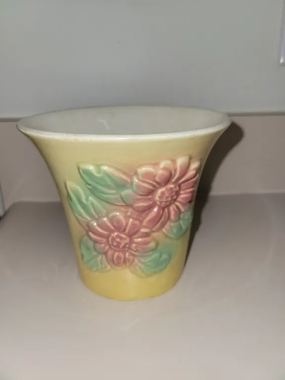 vintage yellow ceramic planter from the Hull Pottery Sunglow line featuring embossed pink daisies an