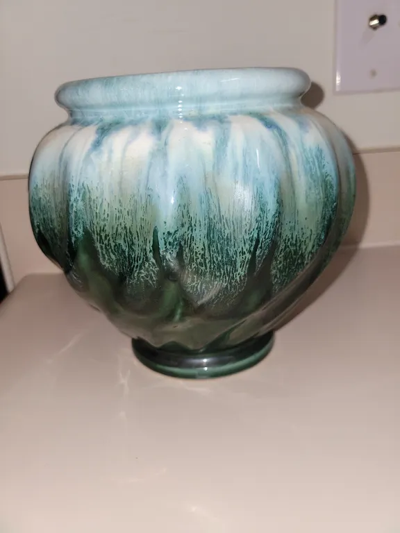 vintage art pottery swirl urn or vase featuring a glossy drip glaze in shades of green and white, re