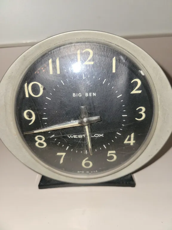 vintage Westclox Big Ben alarm clock featuring a round black dial, silver-toned numerals and hands,