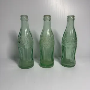 3 Coca-Cola Bottles