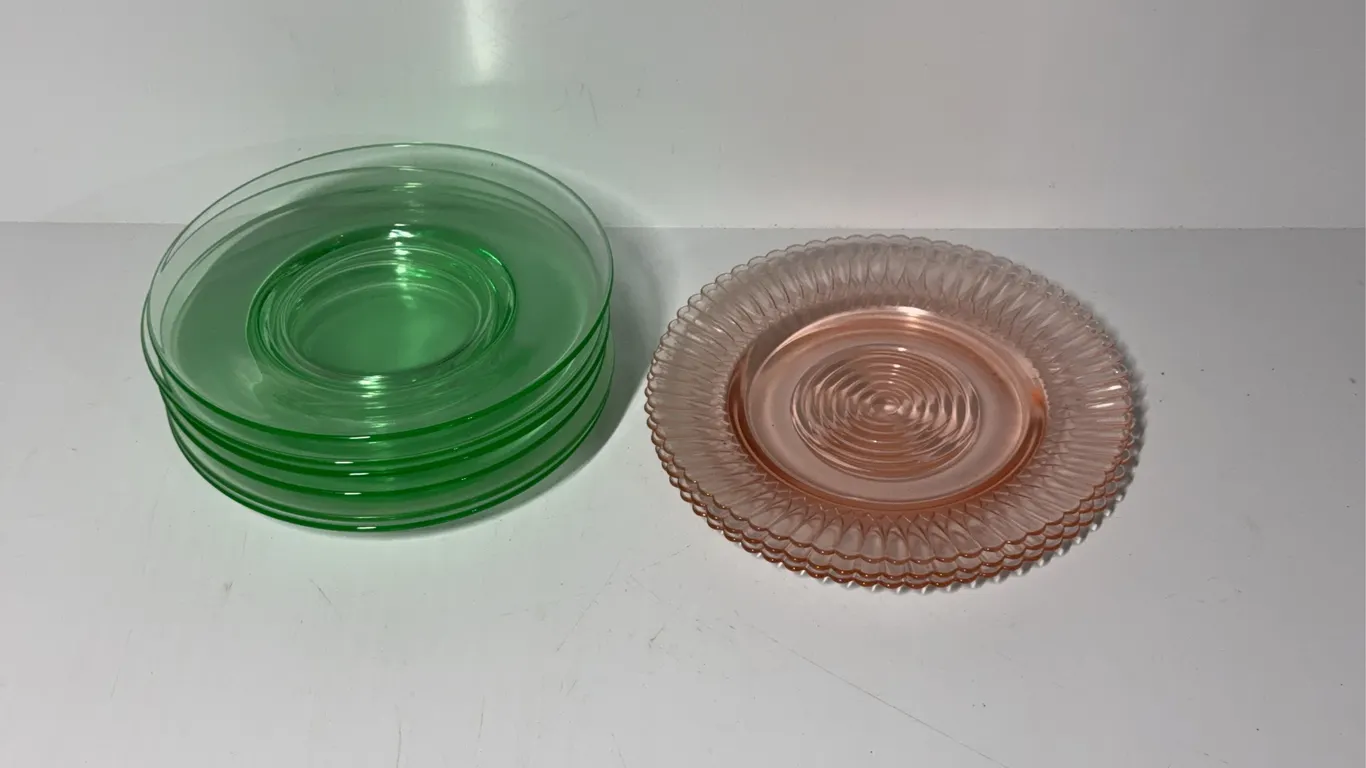 6 green and 3 pink depression era plates