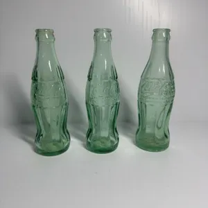 3 Coca-Cola Bottles