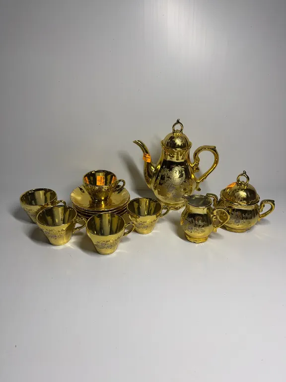 13 piece gold tea set with peacock pattern