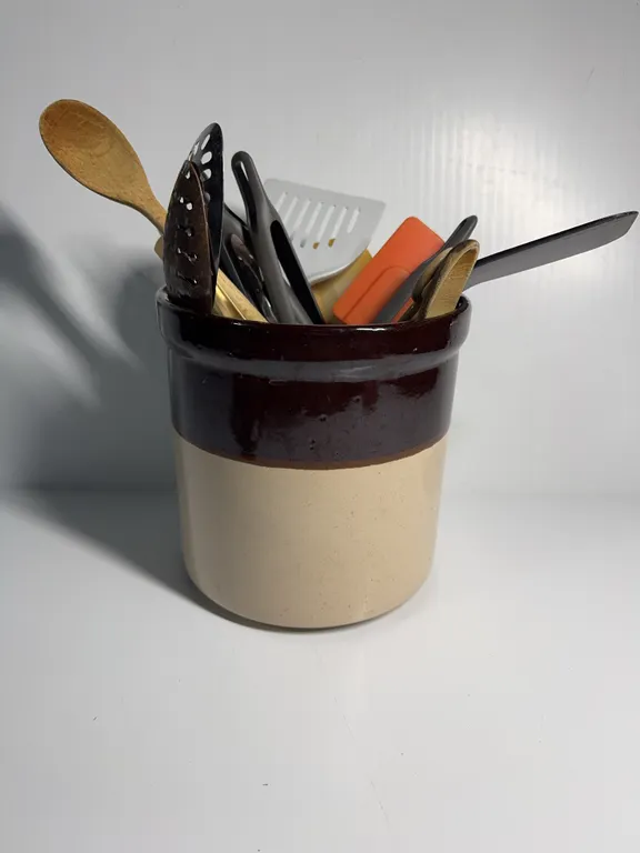 2-tone crock with kitchen utensils