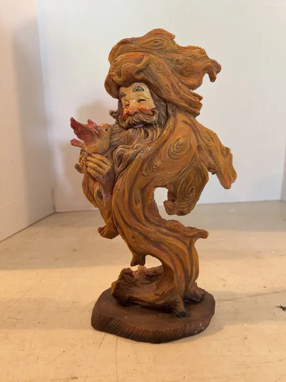 Man Holding Bird Statue 12� Tall