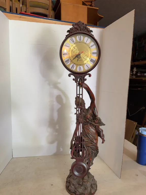 Lady Holding Clock Statue 31�