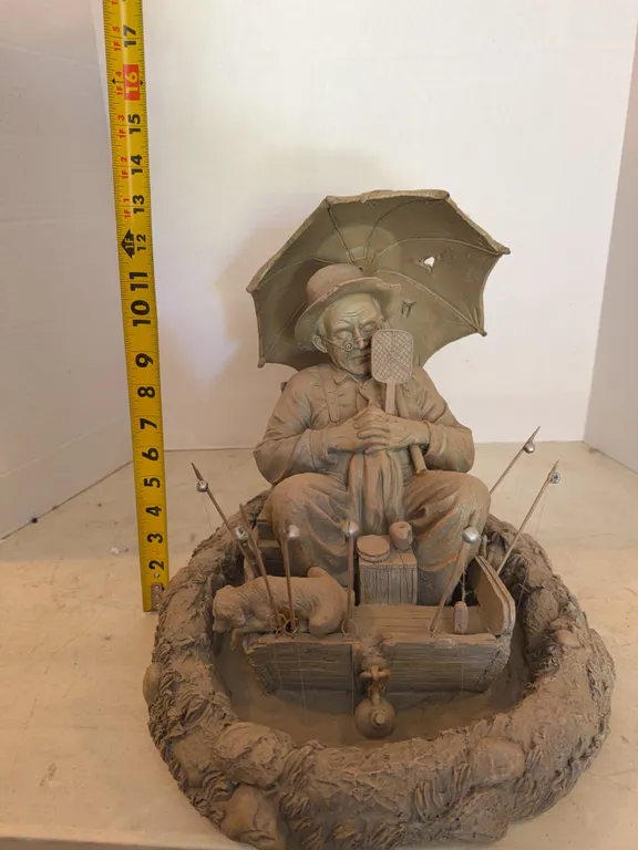 Man Fishing Statue