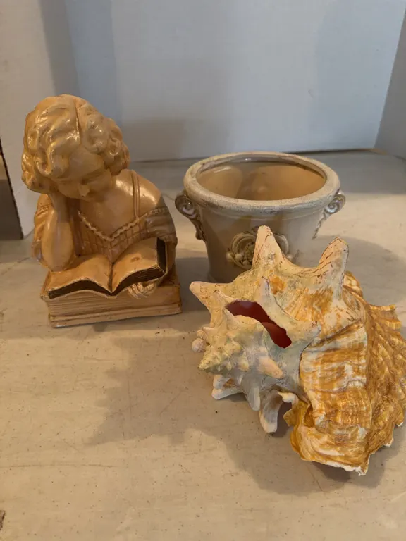 Lady Reading Figurine, Small Pot, And Conch Shell