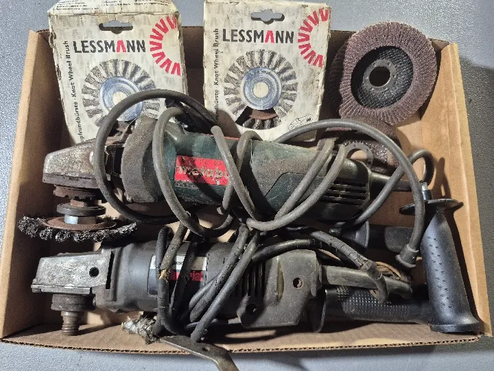 Two angle grinders and discs