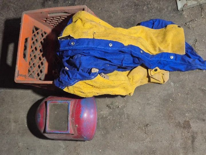 Welding jacket and welding helmet in crate