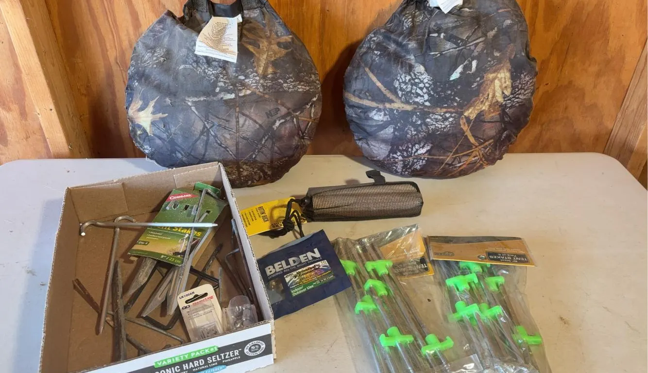 (2) Heated Camo Cushions, Ruttin’ Buck Rattling Bag, Tent Stakes & More