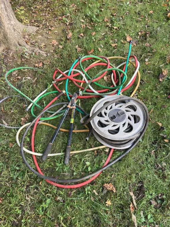 Assortment of Garden Hoses (1) On Reel & Fiskar Lopper