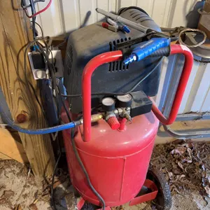 Central pneumatic 17 gallon air compressor three nozzle attachments and air hose reel
