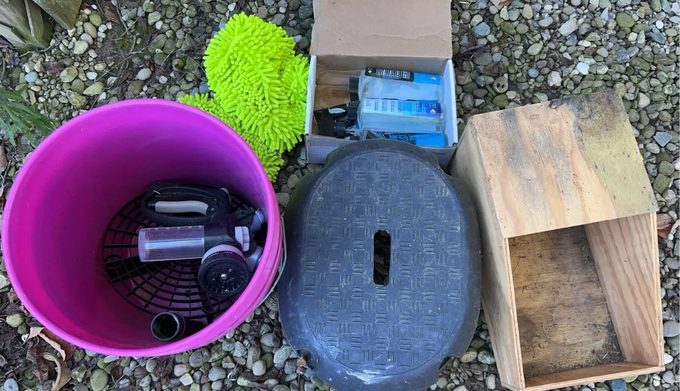 Car cleaning supplies, wood box and black stool