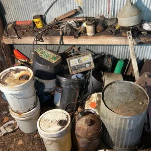 Contents of Pile Including Galvanized Trash Can, Buckets, Mity Mite Charger, Grease Guns & More