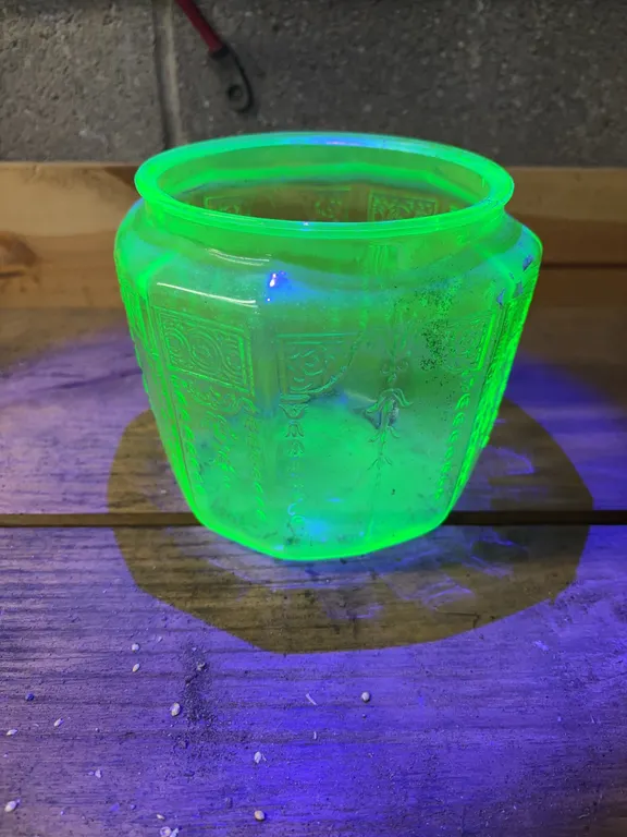 Uranium glass pieces & more ( uranium pitcher is chipped ) ( flower frog is chipped ) ( storage container has no lid )