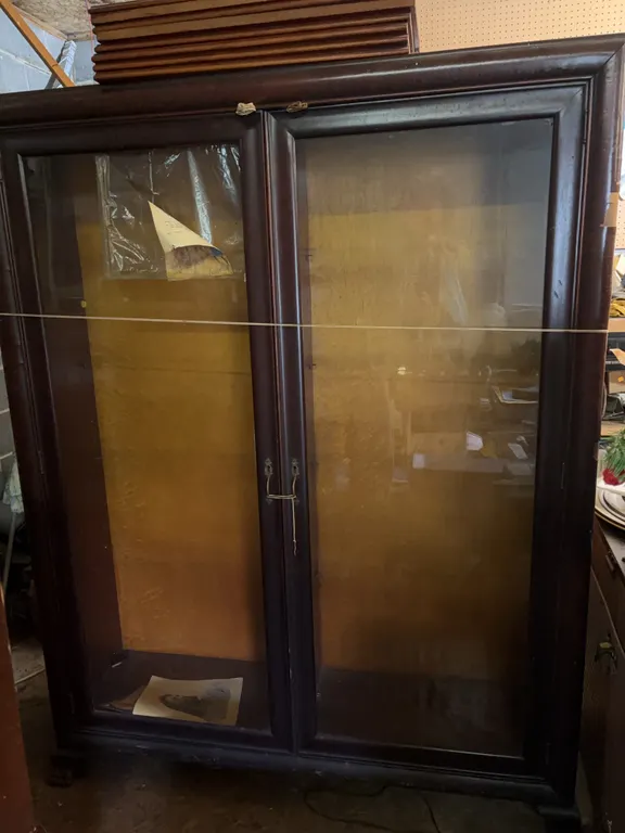 Cabinet w/ shelves (13.5�W x 47.5�L x 62�H) the one piece of glass is broken