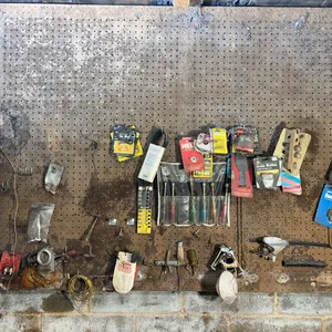 Tools Hanging On Wall Including Buck Knife, Nut Driver Set, Hex Wrench Set & More