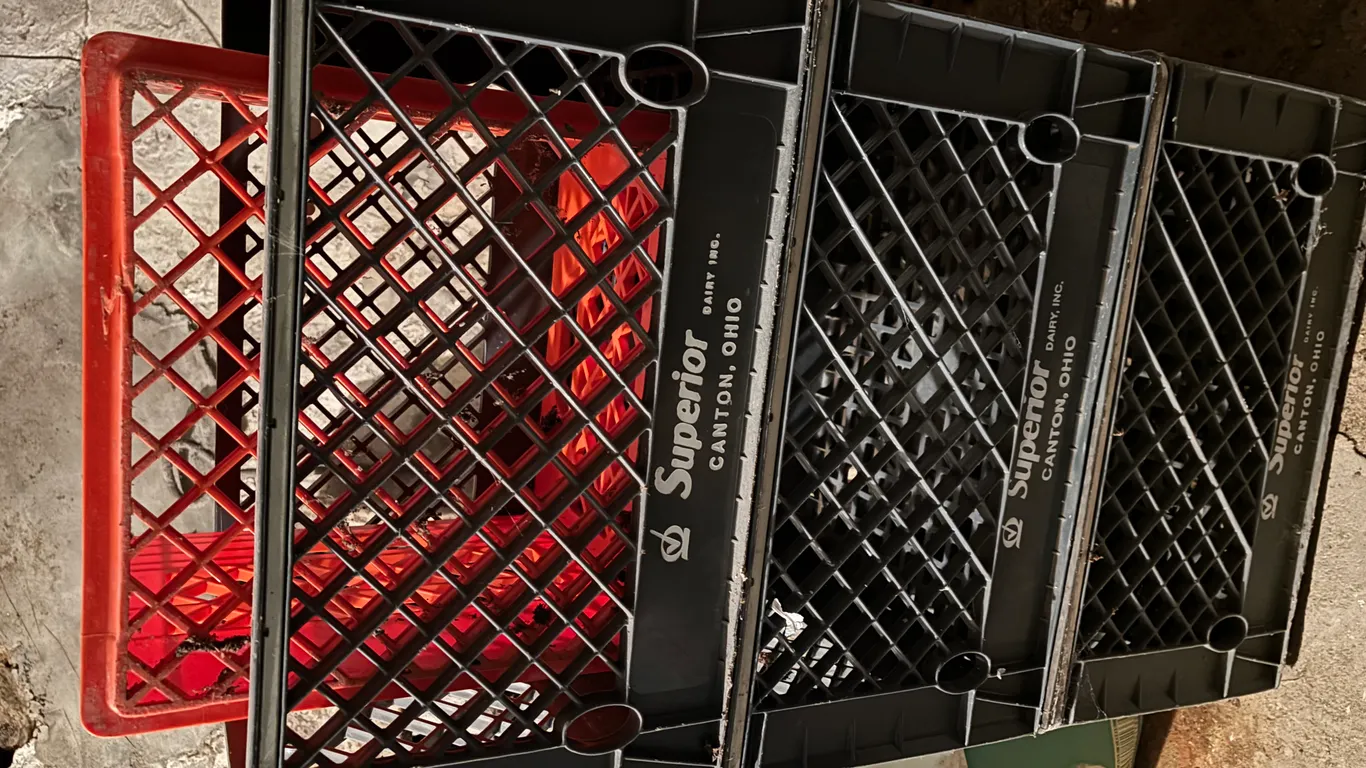 (4)- milk crates ( 1 is goshen dairy )