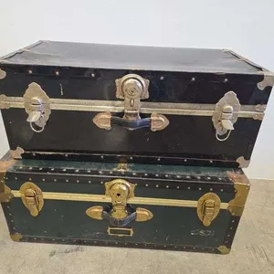 (2) trunks w/ contents- 31"x17"x12"- (1) trunk is locked
