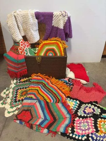 Trunk filled w/ assortment of knitted items- 29"x16"x20"