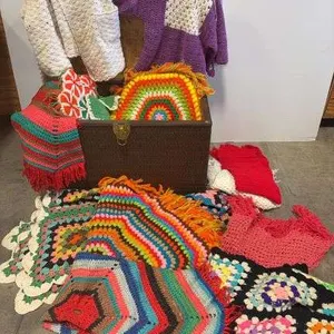 Trunk filled w/ assortment of knitted items- 29"x16"x20"