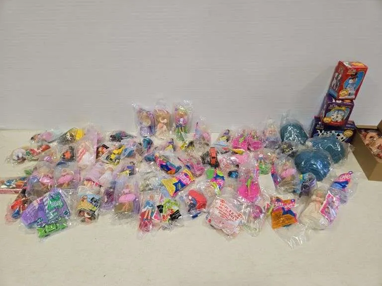 Assortment of McDonald's toys- includes mostly Barbies, a few Cabbage Patch